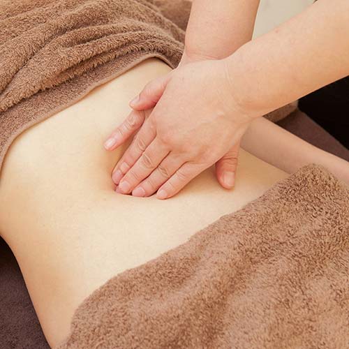 Alison Niddrie Therapy - Girl receiving Abdominal Massage